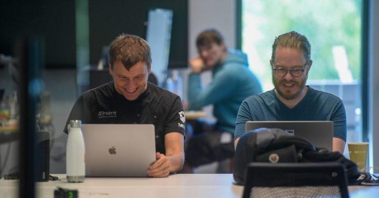 software developers smiling and working
