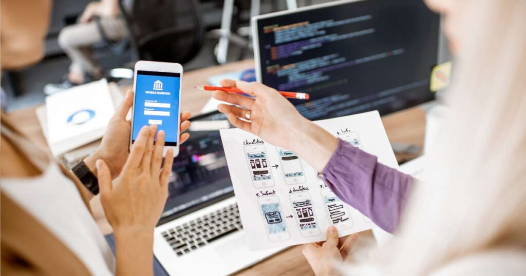 close up of cross-functional team collaborating on mobile software development design
