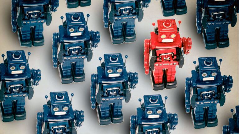 A group of blue robots with one red robot being the odd robot out.