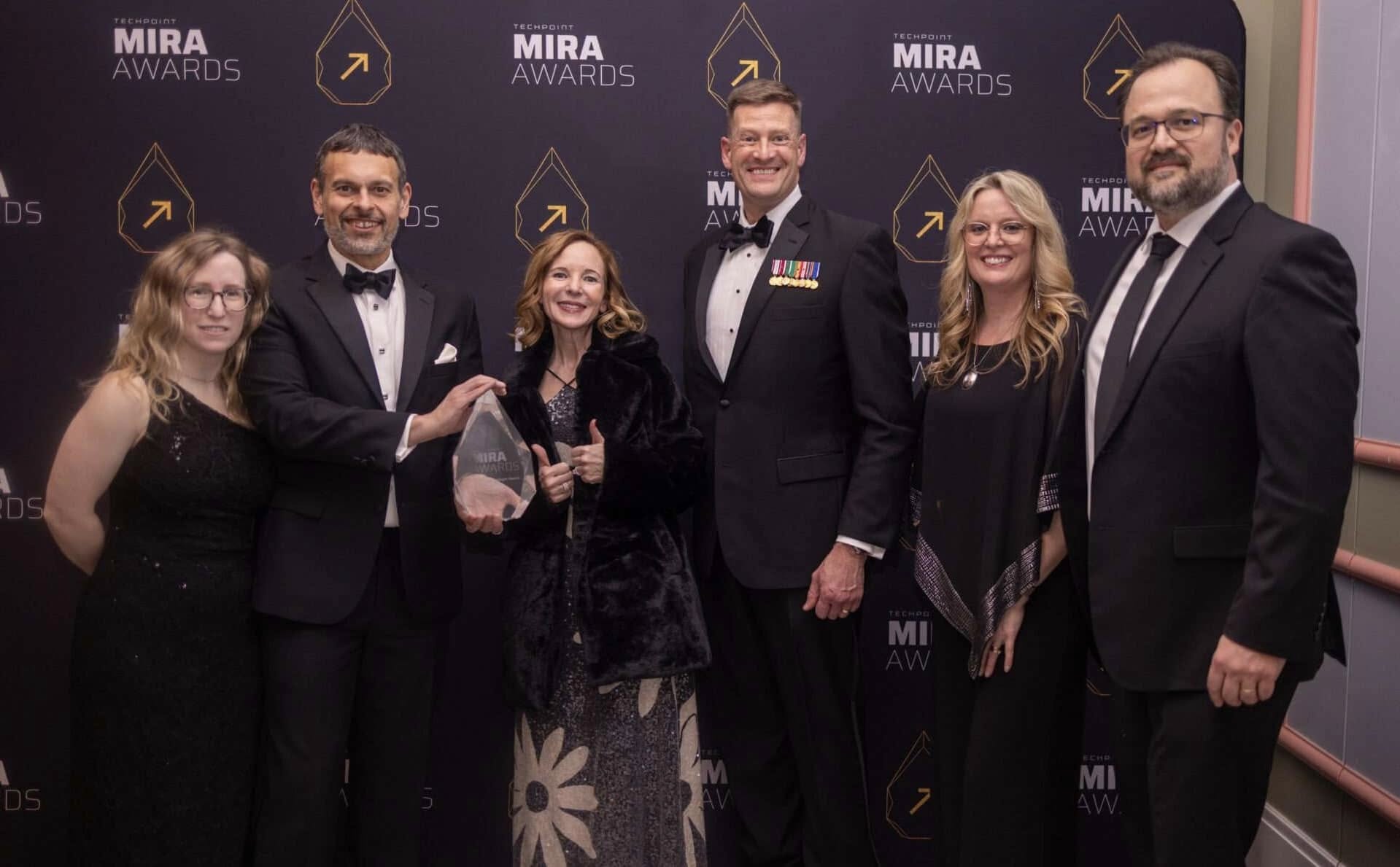 SEP group holding 2025 Exceptional Employer Mira Award Trophy at the gala event