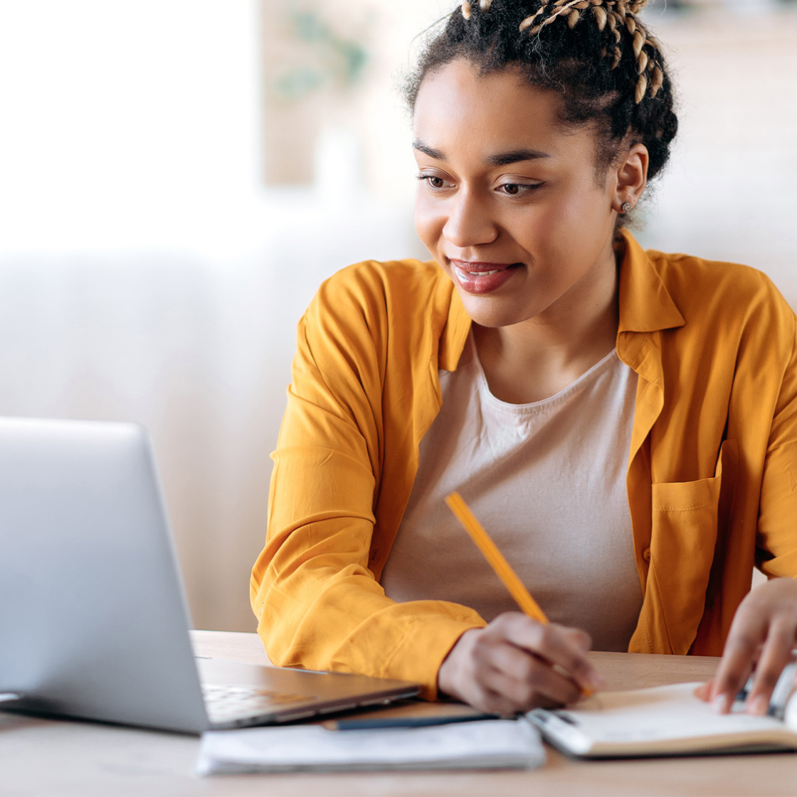 student working on school work remotely on a laptop