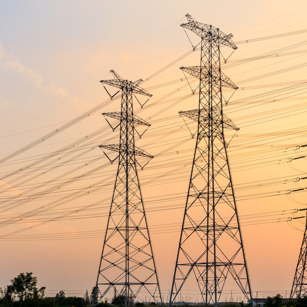 power lines against a sunset sky