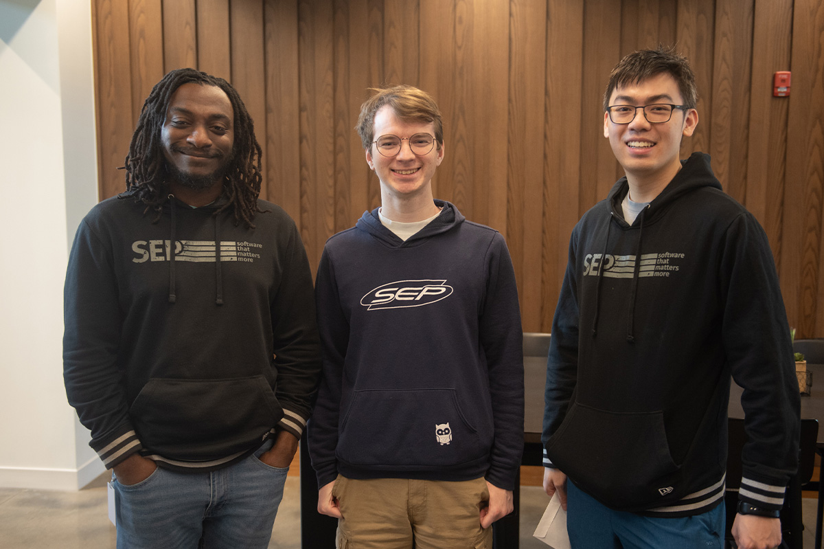 SEPeers standing together wearing SEP hoodies.