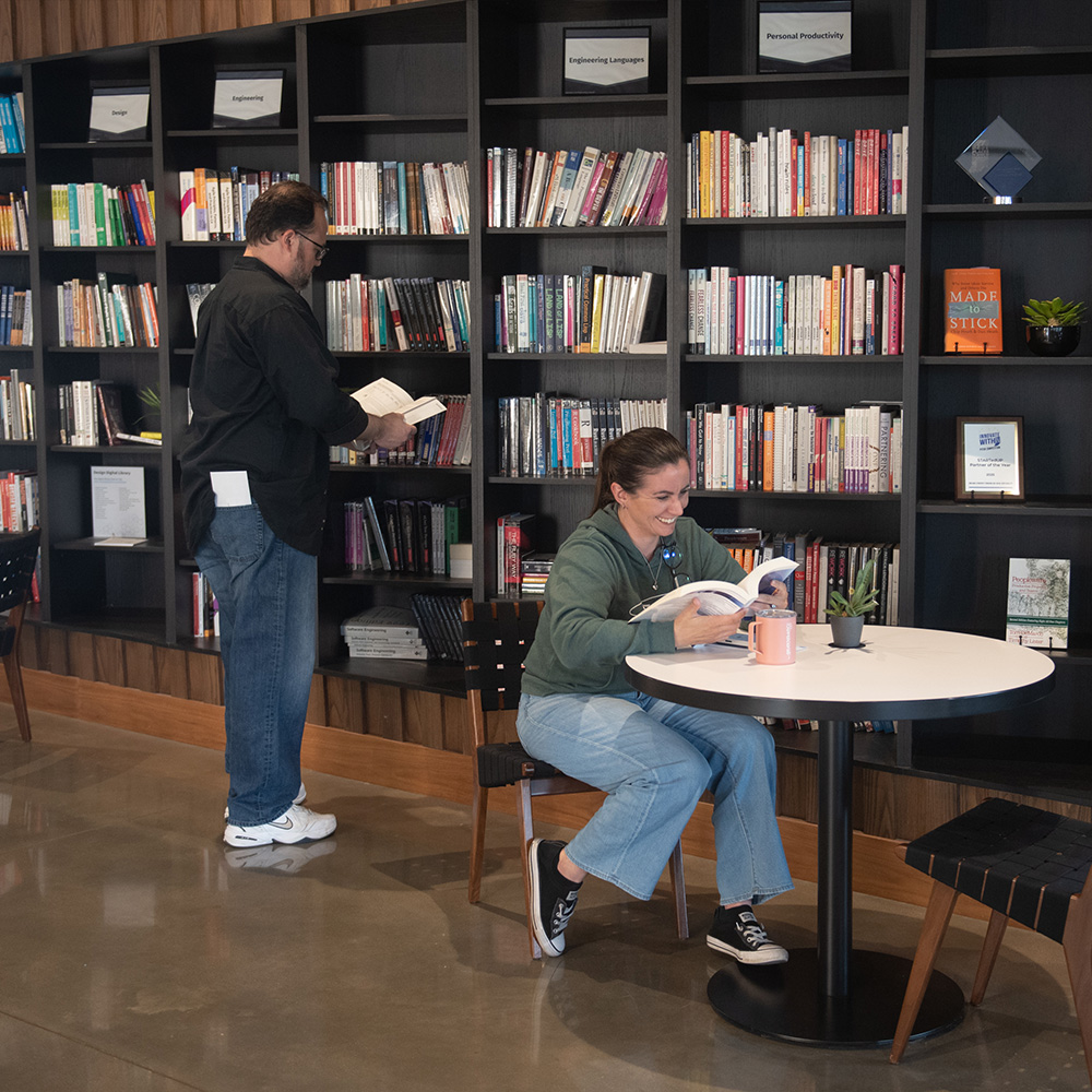 SEPeers in front of the SEP Library reading books.